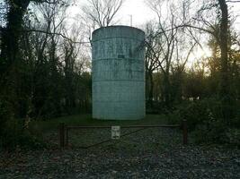 large water tower or storage tank with no parking sign photo