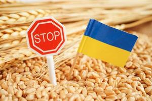 Wheat grains with stop sign, trade export and economy concept. photo