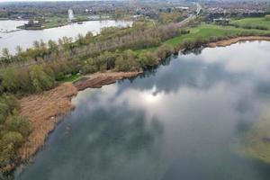 beautiful View of Willen Lake Park with Local and Tourist Public Enjoying the Beauty of Lake and Park by Walking Around with Their Families. Footage Was Captured on 09-April-2023 at Milton Keynes UK photo