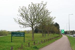 Beautiful Low Angle View of Caldecotte Lake Park and Pub with Restaurant. The Image Was Captured on 09-April-2023 During Cloudy Sunset with Cold Weather and Winds. photo