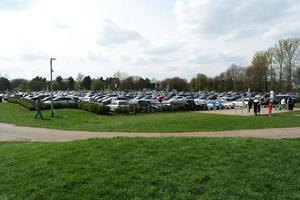 Low Angle View of Willen Lake Park with Local and Tourist Public Enjoying the Beauty of Lake and Park by Walking Around with Their Families. Footage Was Captured on 09-April-2023 at Milton Keynes UK photo