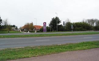 Beautiful Low Angle View of Caldecotte Lake Park and Pub with Restaurant. The Image Was Captured on 09-April-2023 During Cloudy Sunset with Cold Weather and Winds. photo