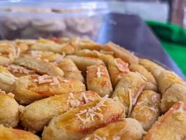 A close up of Kaasstengels, Kastengel or Cheesecake. pastries that are usually served during Eid in Indonesia photo