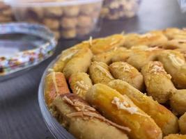 A close up of Kaasstengels, Kastengel or Cheesecake. pastries that are usually served during Eid in Indonesia photo