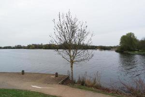 Beautiful Low Angle View of Caldecotte Lake Park and Pub with Restaurant. The Image Was Captured on 09-April-2023 During Cloudy Sunset with Cold Weather and Winds. photo