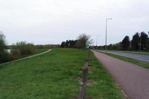 Beautiful Low Angle View of Caldecotte Lake Park and Pub with Restaurant. The Image Was Captured on 09-April-2023 During Cloudy Sunset with Cold Weather and Winds. photo