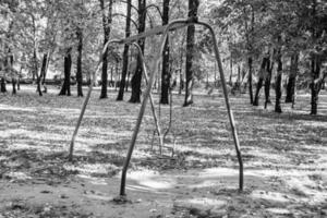 Photography on theme empty playground with metal swing for kids photo