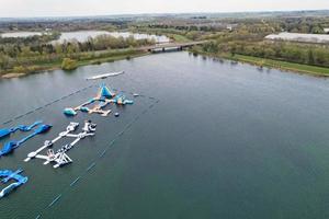 beautiful View of Willen Lake Park with Local and Tourist Public Enjoying the Beauty of Lake and Park by Walking Around with Their Families. Footage Was Captured on 09-April-2023 at Milton Keynes UK photo