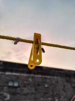 Flies hanging on a clothespin on a string. Blurred and bokeh background photo