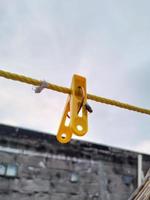 Flies hanging on a clothespin on a string. Blurred and bokeh background photo