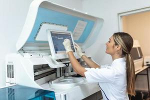 Female Scientist Working in The Lab, Using Computer Screen photo