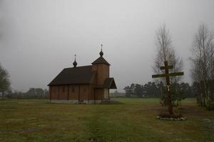 old historic historical wooden church on a gray autumn november day, photo