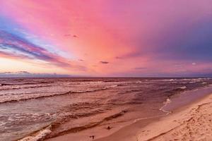 picturesque calm sunset with colorful clouds on the shores of the Baltic Sea in Poland photo