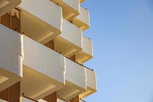 interesting original elements of the balconies in the white building photo