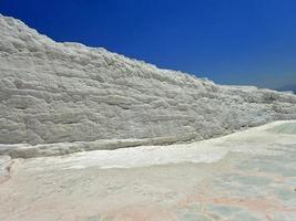 original Pamukkale place in Turkey in Asia landscape with limestone pools with blue warm water photo
