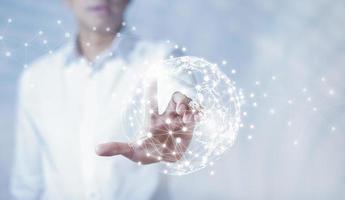 Businessman holding connections system and global data exchange. ,Business network connection concept. hologram screen displaying modern web system Wireless connection futuristic concept photo