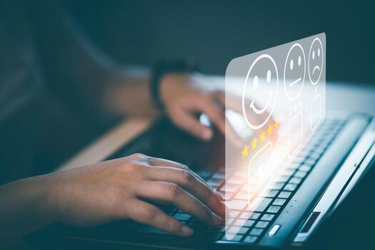 Businessman using laptop computer to input point and evaluation result on company website, Customer service satisfaction survey, satisfaction through the application on tablet screen, rating 5 stars. photo