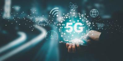 Global network connection 5G on hand business man.Global network connection 5G with icon concept, technology network wireless systems and internet of things, new technologies coming up in the future. photo