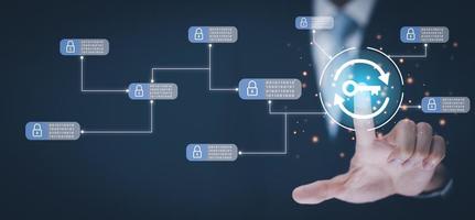 Hand holding keys icon with Blockchain technology on the black background, Blockchain technology concept with a chain of crypto-block, Fintech financial crypto-currencies such as Bitcoin and network photo