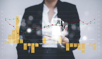 Oil energy graph of the world market, impact on the economy concept,Businesswoman touch chart with the indicator on the oil price slide at gas station, fluctuations in oil prices and exchange trade. photo