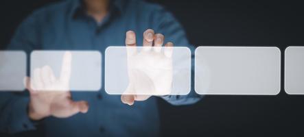 Businessman holding touch screen interface on the black background,graph Screen Icon of media screen, Technology Process System Business with Communication, concepts photo