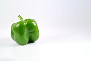 green bell pepper isolated on white background with copy space. photo