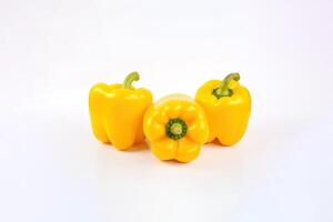 a group of yellow bell pepper isolated on white background. photo