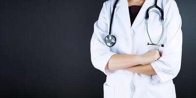 A woman doctor wearing a lab coat with a stethoscope with copy space. photo