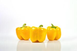 a group of yellow bell pepper isolated on white background. photo