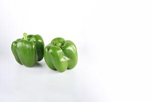 a group of green bell pepper isolated on white background with copy space. photo