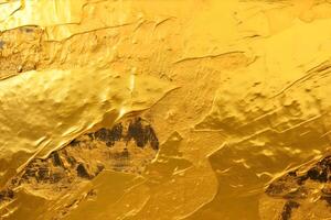 Golden paint texture background. photo