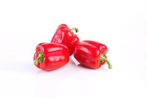 a group of red bell pepper isolated on white background. photo