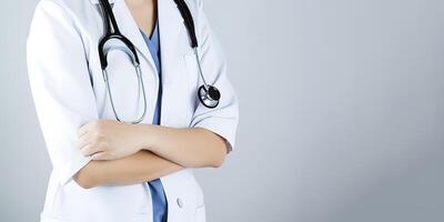 A woman doctor wearing a lab coat with a stethoscope with copy space. photo