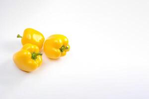 a group of yellow bell pepper isolated on white background with copy space. photo