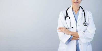 A woman doctor wearing a lab coat with a stethoscope with copy space. photo