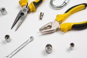 Set of tools for repair in a case on a white background. Assorted work or construction tools. Wrenches, Pliers, screwdriver. Top view photo