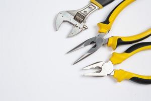 Set of tools for repair in a case on a white background. Assorted work or construction tools. Wrenches, Pliers, screwdriver. Top view photo