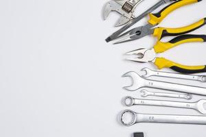 Set of tools for repair in a case on a white background. Assorted work or construction tools. Wrenches, Pliers, screwdriver. Top view photo