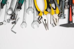 Set of tools for repair in a case on a white background. Assorted work or construction tools. Wrenches, Pliers, screwdriver. Top view photo