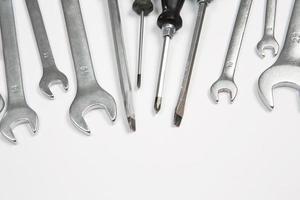 Set of tools for repair in a case on a white background. Assorted work or construction tools. Wrenches, Pliers, screwdriver. Top view photo