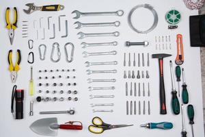 Set of tools for repair in a case on a white background. Assorted work or construction tools. Wrenches, Pliers, screwdriver. Top view photo