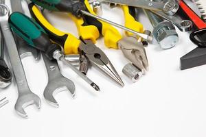 Set of tools for repair in a case on a white background. Assorted work or construction tools. Wrenches, Pliers, screwdriver. Top view photo