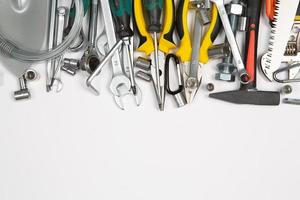 Set of tools for repair in a case on a white background. Assorted work or construction tools. Wrenches, Pliers, screwdriver. Top view photo