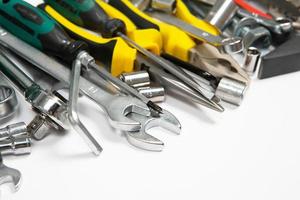 Set of tools for repair in a case on a white background. Assorted work or construction tools. Wrenches, Pliers, screwdriver. Top view photo