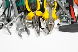 Set of tools for repair in a case on a white background. Assorted work or construction tools. Wrenches, Pliers, screwdriver. Top view photo