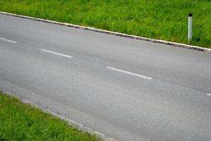 Empty Asphalt Road and Grass photo