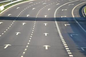Empty Multilane Highway with Forward Arrows photo