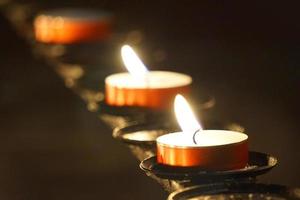 Burning Small Candles - Selective Focus - Religion Concept photo