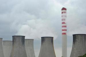 Power Plant with Chimney and Smoke photo