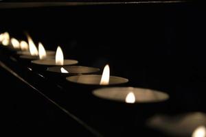 Many Tiny Round Candles Burning photo